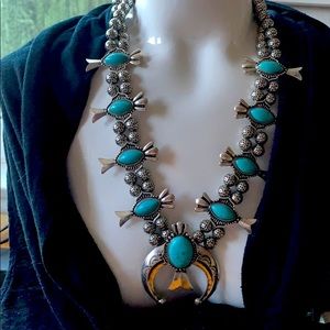 Faux turquoise squash blossom necklace.